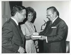 ["Black and white photograph print of Carl Albert, President Josip B. Tito of Yugoslavia, and others standing in Albert's office. November 1971"]