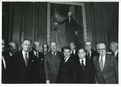 ["Black and white photograph print of Hugh Scott, Mike Mansfield, Harry F. Byrd, Jr., Charles Mathias, Gerald R. Ford, Nicolae Ceausescu (President of Romania), Carl Albert, and George Aiken at the reception for President Ceausescu of Romania. December 5, 1973"]