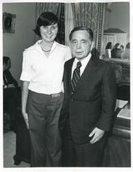 ["Black and white photograph print of Carl Albert posing with a unidentified people."]