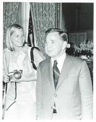 ["Black and white photograph print of Carl Albert standing with Susan Ford."]