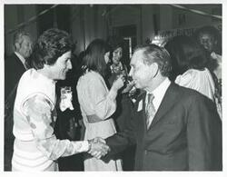 ["Black and white photograph print of Carl Albert with various unidentified people during his birthday, 1976"]