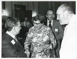["Black and white photograph print of Carl Albert with unidentified people at his birthday party, 1976"]