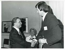 ["Black and white photograph print of Carl Albert with various unidentified people at his birthday party, 1976"]