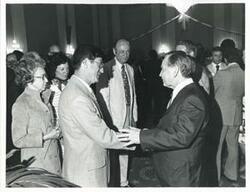 ["Black and white photograph print of Carl Albert with unidentified people at his birthday party, 1976"]