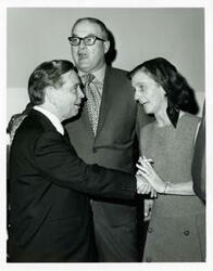 ["Black and white photograph print of Carl Albert with unidentified people."]