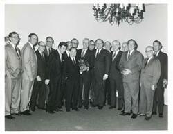 ["Black and white photograph print of Carl Albert with unidentified people."]