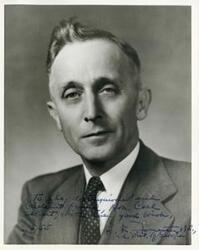 ["Black and white photograph print of a close-up-up studio portrait of E. F. Forrester."]