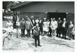 ["Black and white photograph print of Carl Albert at the dedication of the housing projects at Tishomingo. June 1971"]