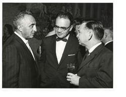 ["Black and white photograph print of Carl Albert, Marcus Cohn, and an unidentified man."]
