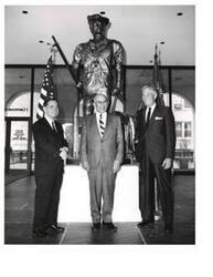["Black and white photograph of Carl Albert in front of a statue at the National Headquarters of the Reserve Officers' Association of the United States. Carl Albert is with two other men. A.S. Mike Monroney is present (at left). June 4, 1969"]