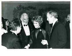 ["Carl Albert greeting a woman. Actor Lorne Greene is shown standing at her right."]