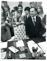 ["Carl Albert standing behind his desk with an Oklahoma REC group. June 1973"]