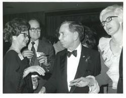 ["Carl Albert in a crowd at a reception."]