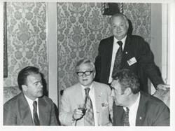 ["Black and white photograph print of group of men at the House delegation trip. August 1975"]