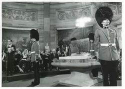 ["Black and white photograph print of Carl Albert and several others at a ceremony in the Capitol. Albert is speaking. Arrival of Magna Carta."]