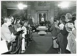 ["Black and white photograph print of several people at a ceremony in the Capitol rotunda honoring arrival of the Magna Carta."]