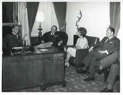 ["Black and white photograph print of Carl Albert and President Josip B. Tito of Yugoslavia with several others in Albert's office. November 1971"]