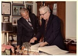 ["Color photograph of Tom Steed with Rex Davis, director of the Bureau of Alcohol, Tobacco and Firearms in his office."]
