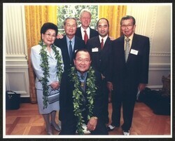 ["Senator Inouye wears medal of honor."]