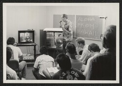 ["Caption: Senator Daniel Inouye inaugurates low-cost videoconferencing from the Senate Office Bldg, conversing with students at the U. of Hawaii. Although they are 5000 miles apart, they see each other with still pictures sent over the ordinary telephone l"]