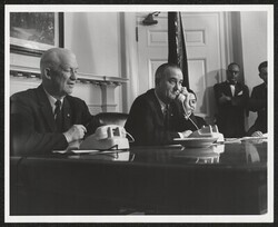 ["Caption: Cable - Submarine Japan-Hawaii. Opening ceremonies of the Transpacific Cable, Washington. At left: Comm. Hyde of F.C.C. Pres. Johnson on phone. 6/18/64. Stamp: American Telephone and Telegraph Company."]