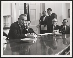 ["Caption: Cable - Submarine Japan-Hawaii. Opening ceremonies of the Transpacific Cable, Washington. Pres. Johnson on phone. Eugene McNeely, ATT Pres., seated at the phone. 6/18/64. Stamp: American Telephone and Telegraph Company."]