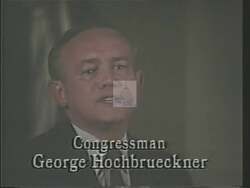 ["In the 1988 campaign ad, Democratic candidate George Joseph Hochbrueckner highlights his dedication to effective constituent service. Through various scenes, he showcases his work at his desk and at town hall meetings, discussing achievements in constituent service and government efficiency, and emphasizes his commitment to achieving and enhancing government response to public concerns."]