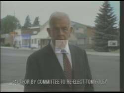 ["In the 1994 presidential campaign ad, Democratic candidate Thomas S. Foley emphasises his commitment to robust domestic policies. Throughout the ad, Foley speaks vigorously at various venues, promoting community responsibility, and advocating for reforms in law enforcement, welfare, and immigration. His speeches, often before the backdrop of American flags, underline his dedication to strengthening America's internal security and improving national policies."]