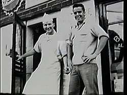 ["In the 1994 presidential campaign ad, Democratic candidate Duke deTremble exudes confidence and dedication at various political events. Scenes showcase him engaging with factory workers, addressing enthusiastic crowds, and promoting his congressional run, surrounded by campaign banners and supporters. The ad emphasizes his strong leadership and commitment to public service."]