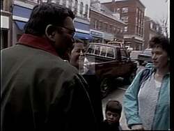 ["The 1994 campaign ad for Dennis L. (Duke) Dutremble depicts him engaging with factory workers, advocating for job creation, family leave, and healthcare. His speeches at rallies underscore his commitment to Maine's working families and successful policies, resonating with crowds as he exemplifies leadership and dedication to improving their lives."]