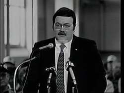 ["In this 1994 political TV ad, Democratic candidate Duke DeTremble presents himself as a confident and dedicated leader. The ad showcases scenes of DeTremble among Maine's landscapes, at various rallies, and speaking passionately at podiums with \"DeTremble for Congress\" banners. His consistent confident demeanor and strong leadership qualities resonate throughout the ad, appealing to voters' desire for legislative progress and commitment."]