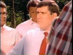 ["The 1990 campaign ad for Democratic Party candidate Kurt Glasgow features various scenes depicting public outrage towards the Savings and Loan scandal. It shows large crowds protesting poor financial management and demanding political accountability. Glasgow is seen passionately addressing the crowd, criticizing the congressional response, and advocating for significant change and leadership."]