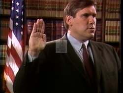 ["The political TV ad for Kurt Glassco's 1990 presidential campaign features repeated scenes of Glassco solemnly taking the oath as an assistant district attorney, showcasing his commitment to law and integrity. These images are contrastively juxtaposed with admissions of legal infractions by his opponent, Jim Inhofe, underscoring a stark difference in ethical standards."]