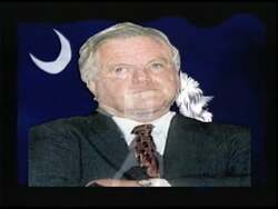 ["In the 1996 political TV ad for Republican candidate Larry Bigham, text overlays critically compare John Spratt's voting record with that of Kennedy to sway voter opinion. Despite the lack of descriptive visuals, the emphasis is clear���������highlighting differences aimed at questioning Spratt���������s choices and aligning Bigham with preferred policies."]