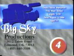 ["In his 1994 campaign ad, Democratic candidate David Perryman stands on a desolate Main Street, symbolizing economic challenges. He passionately advocates for revitalization and job creation, with a clear commitment to rejuvenating the local economy. His presence on the empty street underscores the urgency and focus of his economic plans."]