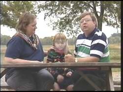 ["In the 1994 presidential TV ad, Steve Gill, a Nashville lawyer and congressional candidate, is portrayed critically for his positions. The ad features Gill giving speeches and participating in debates, where he is depicted as defensive while being criticized for opposing minimum wage increases and college grants. His stern and earnest expressions accompany controversial viewpoints, indicating a divisive political stance."]