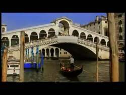 ["In his 2012 campaign ad, George E. B. Holding criticizes President Obama's government spending, focusing particularly on investments in art exhibits in Italy that include surreal installations like inverted tanks in Venetian canals. Holding advocates for spending cuts, utilizing stark visual metaphors to highlight what he considers fiscal irresponsibility."]